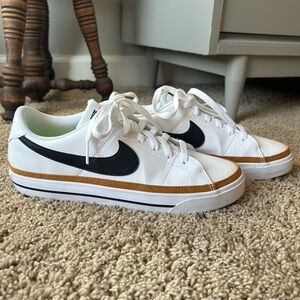 Nike White and Black Sneakers with Gold Accents